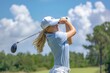 © mariof - Young woman golfer in a golf course on a beautiful sunny day