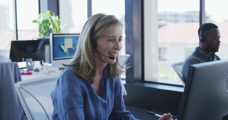 Wall Mural - Image of 6g texts over caucasian woman using phone headset