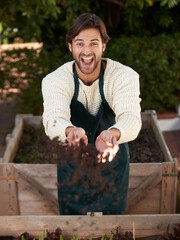 Farmer, man and throw soil for agriculture, funny and laughing for sustainability of nature. Portrait, gardener and happy person with fertilizer, earth and dirt for ecology of plants in environment