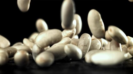 Sticker - Falling white beans on a black background. Filmed on a high-speed camera at 1000 fps. High quality FullHD footage