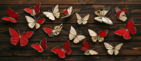 Wall Mural - Wedding butterflies in red and beige, on a wooden backdrop, for the groom and masters.