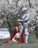 Fototapeta  - The story of a knight. Farewell to the red-haired beloved on the lake shore