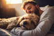 Young man and cute dog sleeping together