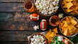 Super Bowl snacks like popcorn, nachos, or a bowl of chips with copy space - AI Generated