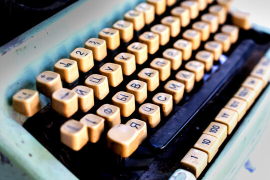 Antique typewriter cyrillic keys close up and russian keys selective focus