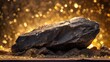 A large rock, a lump of native gold, is sitting on top of a pile of dirt, resembling unrefined sparkling gold nugget and black gold.