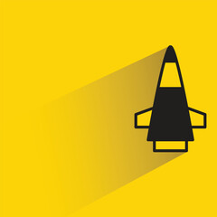 Wall Mural - missile icon with shadow on yellow background