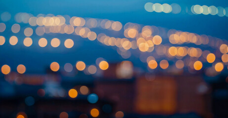 Poster - City blurring lights abstract circular bokeh on blue background