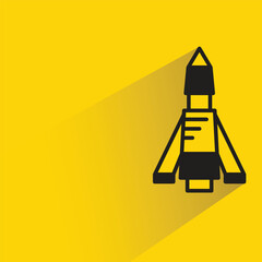 Sticker - missile and rocket icon with shadow on yellow background