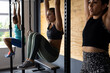 © Wavebreak Media - Multiracial young females hanging confidently on gymnastic bars in health club