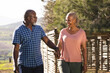 © Wavebreak Media - Happy senior african american couple holding hands and walking in sunny nature