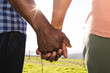 © Wavebreak Media - Holding hands of senior african american couple in sunny nature