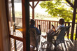 © Wavebreak Media - Senior african american couple drinking wine on sunny terrace