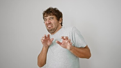 Wall Mural - Fearful young man in t-shirt, showing aversion with hands raised in disgust, displeased and utterly annoyed, isolated on white background