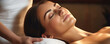 Portrait of a beautiful gorgeous relaxed pleasant woman with neck pain, professional head acupuncture massage therapist, modern beauty spa, aroma oil. Massage therapist for face and body skin care