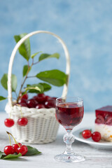 Wall Mural - Cherry liqueur in a carafe and glasses