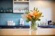 © primopiano - fresh-cut flowers in a vase on studio reception desk