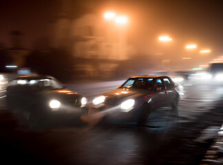 Cars collision at night in motion blur