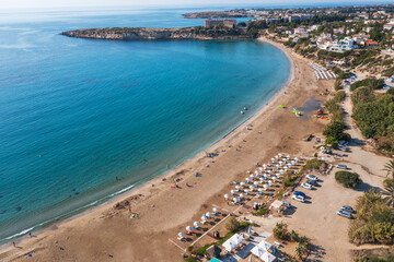 Wall Mural - Expansive aerial view of Cyprus sandy beach and azure ocean water, natural beauty of coastline and vastness of sea. Summer travel and mediterranean resorts.