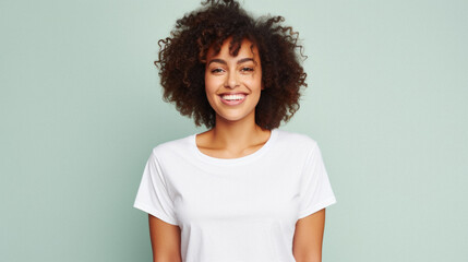 Wall Mural - Young happy smiling African American woman model wearing tshirt standing on color background. Face skin hair care cosmetics makeup, fashion ads. Beauty portrait. White t-shirt mock up template .