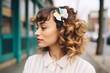 tousled honey curls fastened with a pastel macram hair clip