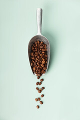 Canvas Print - Scoop of Roasted Coffee Beans Spilling Over