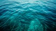 Blue green surface of the ocean in Catalina Island California with gentle ripples on the surface and light refracting   