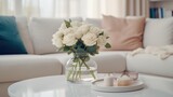 Fototapeta Koty - Close up of glass vase with flowers on round coffee table near white sofa. Scandinavian style home interior design of modern living room