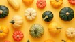 Overhead view winter squash pattern on yellow background