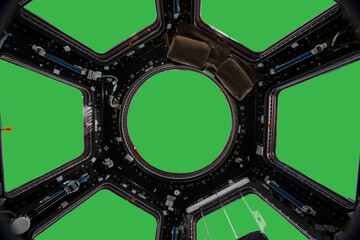Wall Mural - porthole of space station isolated on green background. elements of this image furnished by nasa.