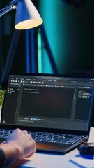 Poster - vertical video skilled computer scientist writes code on laptop screen while in living room office u