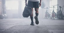 Person, Athlete And Walking With Bag In Gym For Boxing Challenge For Competition, Physical Activity Or Wellness. Legs, Shoes And Muscle In Training For Fight Workout Or Exercise, Confident Or Health