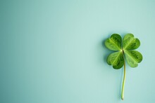 Shamrock Four Leaf Clover On Light Blue Background With Copy Space. St. Patrick's Day Concept.	
