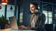 © Art AI Gallery - Smiling businesswoman in headphones using laptop and listening music in office