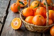 a basket of oranges on a wood surface