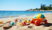 Toys On The Sand. Toys On The Beach. Bucket Of Beach Balls And Other Beach Toys In The Sand On The Beach During Summertime. Summertime Activities By The Beach