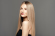 © Beauty Agent Studio - Hair care model.Beauty young woman with long healthy hair posing against grey background. Beauty salon concept