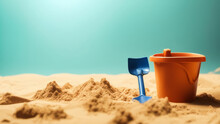 Sandbox With A Child's Bucket And A Shovel On It.