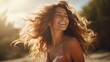 young woman laughing with light hair in the field, in the style of golden hues, wavy, beach portraits