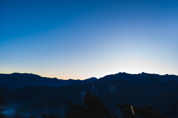 Wall Mural - Breathtaking sunrise vista from Alishan Mountain, Taiwan. The Alishan National Scenic Area is a mountain retreat and nature reserve situated in Alishan Township, Chiayi County, Taiwan.