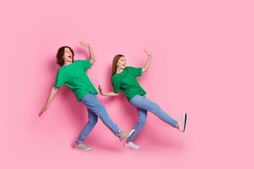 Poster - Full length body photo of two best friends teenagers synchronized moves dancing together boogie woogie isolated on pink color background