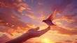 Hand holding a bird on sunset sky background. Bird in the hand