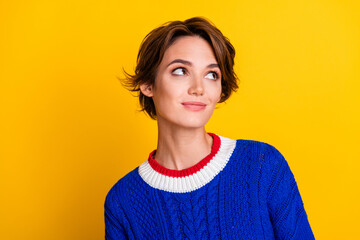 Canvas Print - Photo portrait of pretty young girl look interested empty space wear trendy blue knitwear outfit isolated on yellow color background