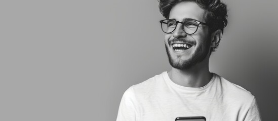 Sticker - Man with glasses happily messaging on gray backdrop.