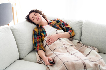 Poster - Photo of good mood cheerful guy wear plaid shirt watching tv sleeping couch indoors room home house