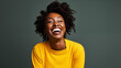 happy smiling beautiful black woman laughing on a plain background