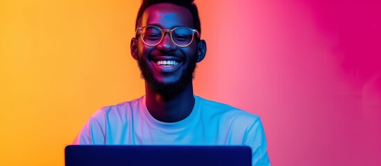 Sticker - Blue Perennial colored man with a laptop and glasses, smiling in trendy neon light for cyber security and technology, showcasing open laptop copy space for a big date as a freelancer.