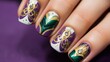 A close-up photo of a hand with Mardi Gras nail art, intricate designs in purple, green, and gold, with swirls, stripes, and a detailed mask design