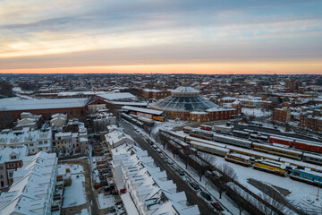 Wall Mural - Drone View of Baltimore City Houses with Snow Covered Roofs at Sunset