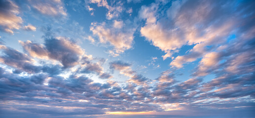 Wall Mural - Panoramic background of evening sky with beautiful stormy clouds